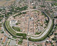 Aerial view of Cittadella + inscription: 'Zitac spa is an Urban Transformation Company (Stu) set up on the initiative of the Municipality of Cittadella in order to build and manage two production areas covering a 674,000 sq. m. total surface'